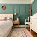 Green Shaker Wall Panelling behind bed in bedroom